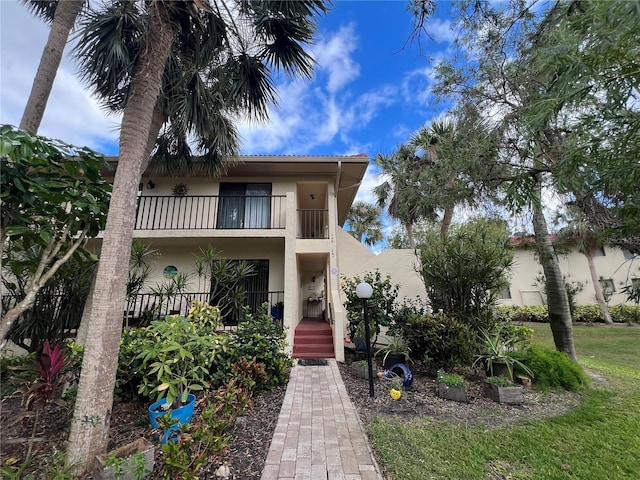 view of front of home with a balcony