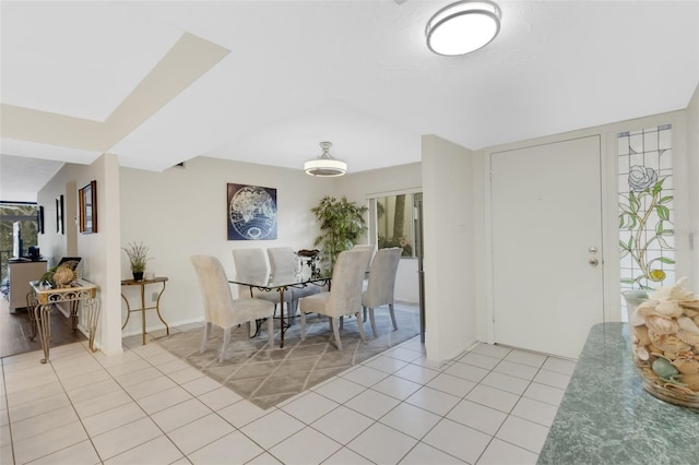 dining area with light tile patterned floors