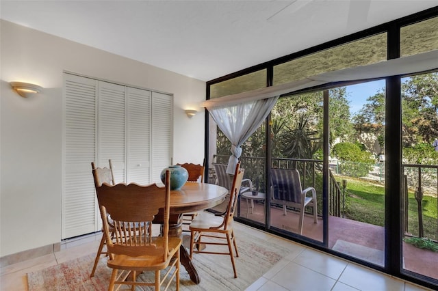 tiled dining space with expansive windows