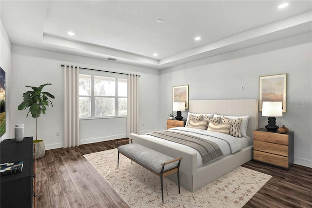 8007 Nevis Run, Bradenton, FL 34202 - bedroom featuring dark wood finished floors, a raised ceiling, baseboards, and recessed lighting