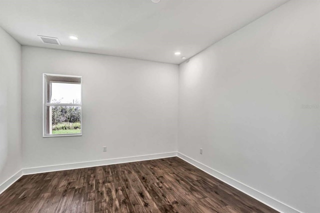 8007 Nevis Run, Bradenton, FL 34202 - empty room featuring dark wood-type flooring, baseboards, and recessed lighting