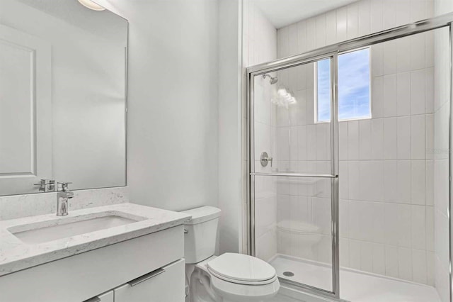 8007 Nevis Run, Bradenton, FL 34202 - bathroom with a stall shower, toilet, and vanity