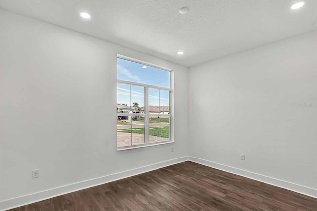 8007 Nevis Run, Bradenton, FL 34202 - spare room featuring baseboards, dark wood finished floors, and recessed lighting