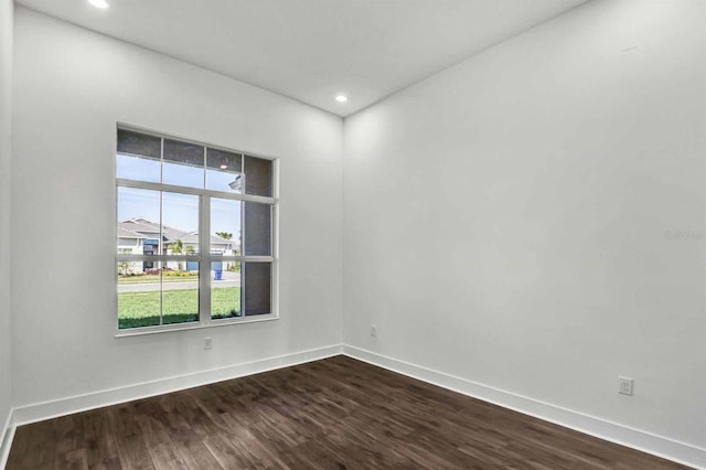 8007 Nevis Run, Bradenton, FL 34202 - unfurnished room with dark wood-type flooring, baseboards, and recessed lighting