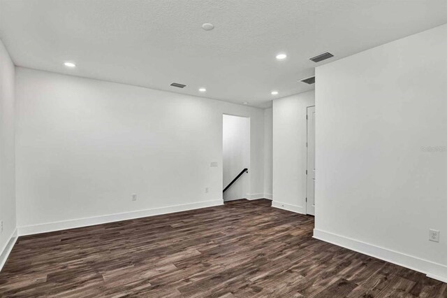 8007 Nevis Run, Bradenton, FL 34202 - spare room with dark wood-style flooring, recessed lighting, and baseboards