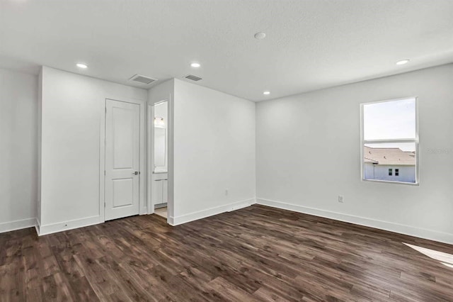 8007 Nevis Run, Bradenton, FL 34202 - spare room with dark wood-type flooring, baseboards, and recessed lighting