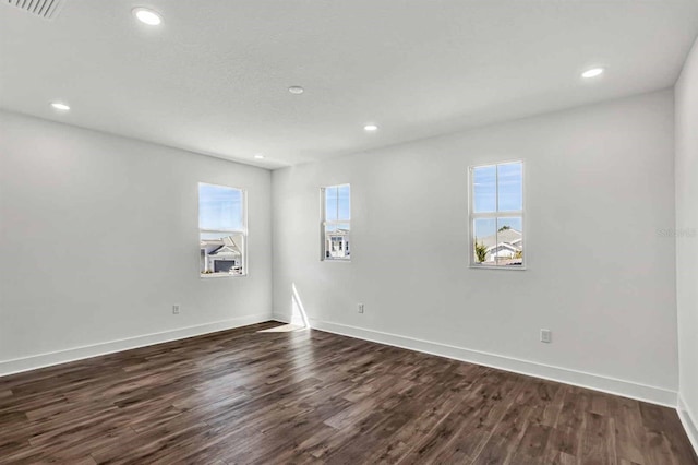 8007 Nevis Run, Bradenton, FL 34202 - unfurnished room with dark wood-style floors, recessed lighting, and baseboards
