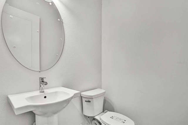 8007 Nevis Run, Bradenton, FL 34202 - half bath featuring a sink and toilet
