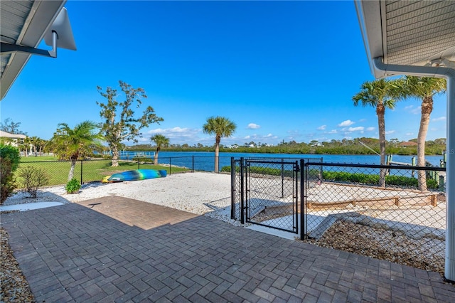 view of patio featuring a water view