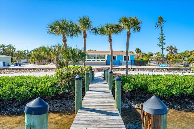 back of house with a water view