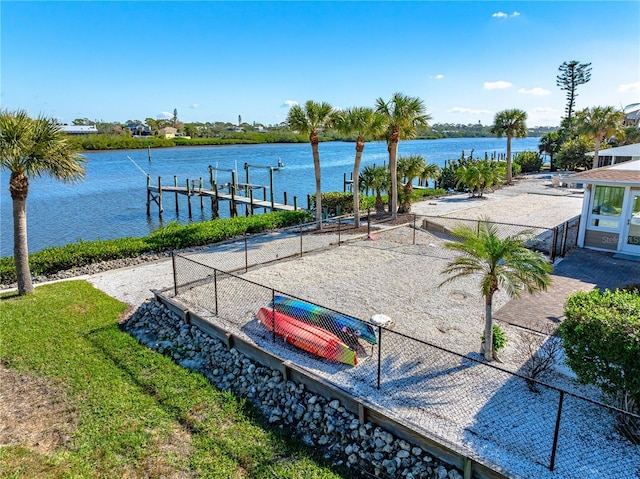 view of property's community with a boat dock and a water view