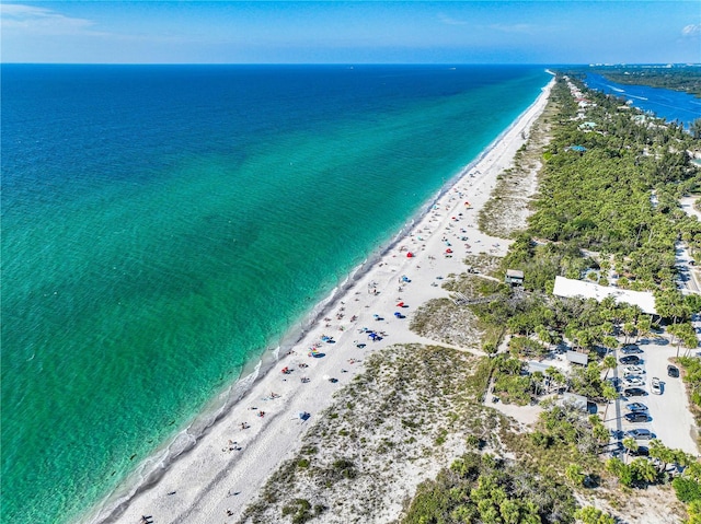 bird's eye view featuring a view of the beach and a water view