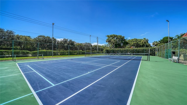 view of sport court with basketball hoop