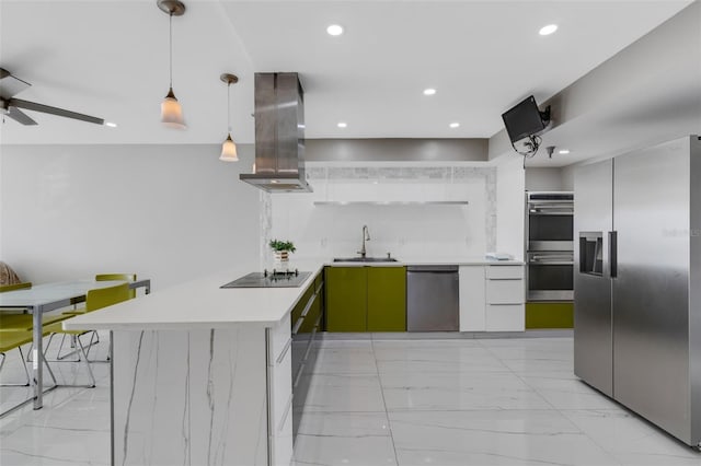 kitchen with island exhaust hood, appliances with stainless steel finishes, sink, pendant lighting, and white cabinetry