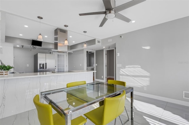 dining area with ceiling fan