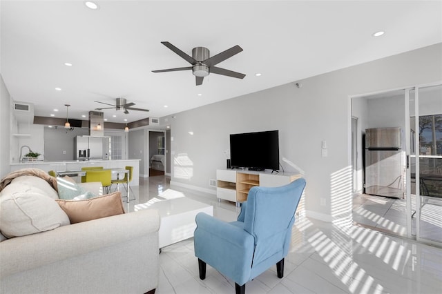 living room with ceiling fan