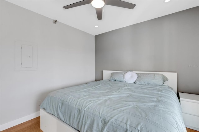 bedroom with ceiling fan and light wood-type flooring