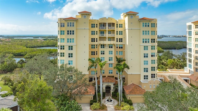 view of building exterior with a water view