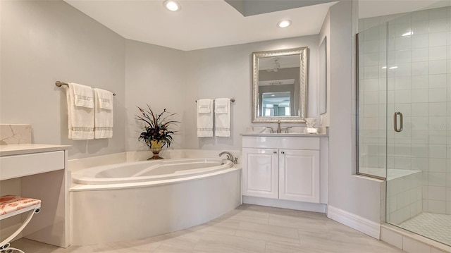 bathroom with vanity and separate shower and tub