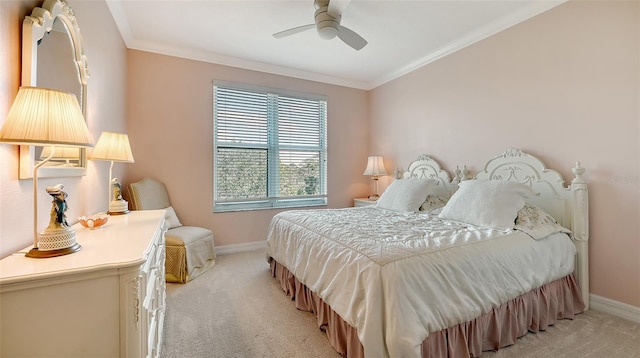 bedroom with light colored carpet, ceiling fan, and crown molding