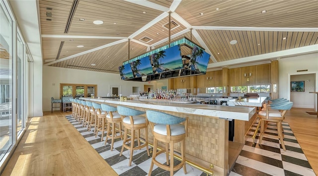 interior space with light wood-type flooring, high vaulted ceiling, and wooden ceiling