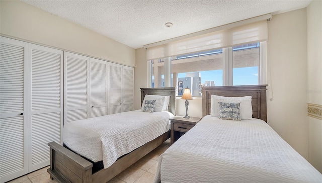 bedroom with a closet and a textured ceiling