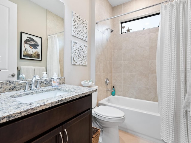 bathroom with shower / tub combo with curtain, vanity, and toilet