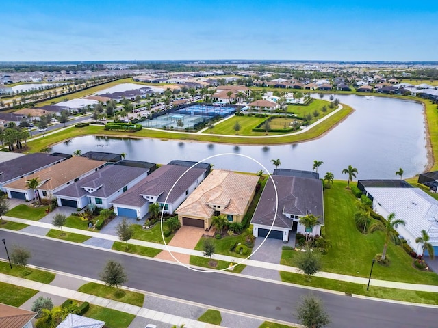 birds eye view of property featuring a residential view and a water view