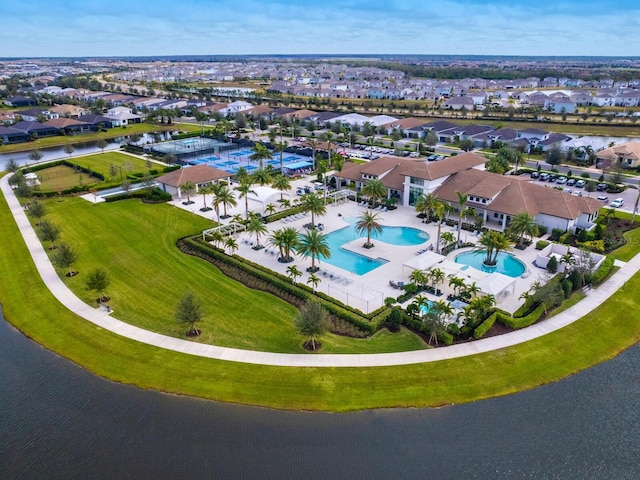 drone / aerial view featuring a water view and a residential view