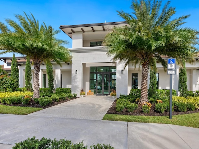 exterior space featuring french doors and stucco siding