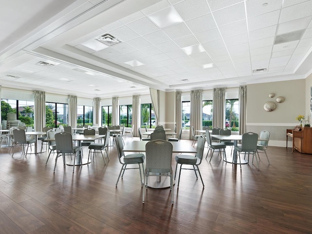 dining space featuring visible vents and dark wood-style flooring