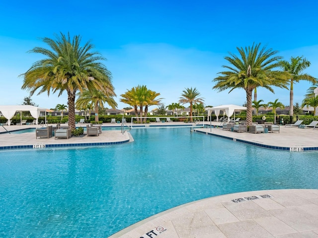 community pool with a patio area