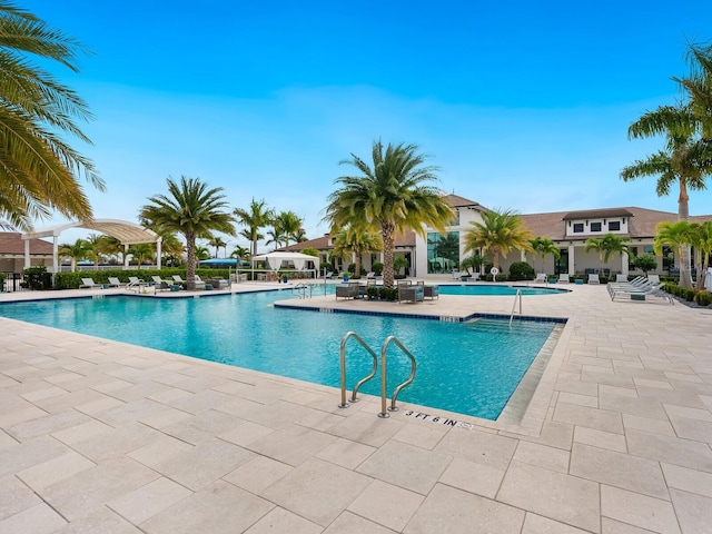 community pool with a patio area