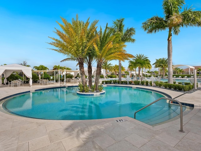 pool featuring a patio area and a gazebo