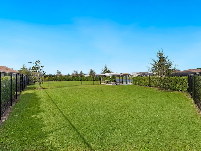 view of yard with a fenced backyard and a gazebo