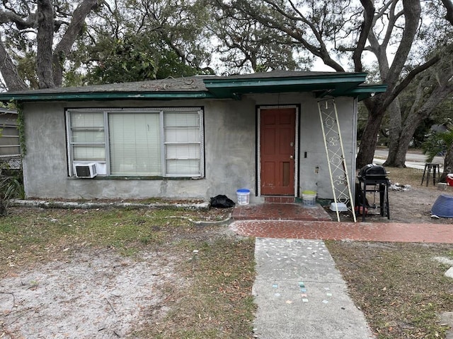 view of front of house featuring cooling unit