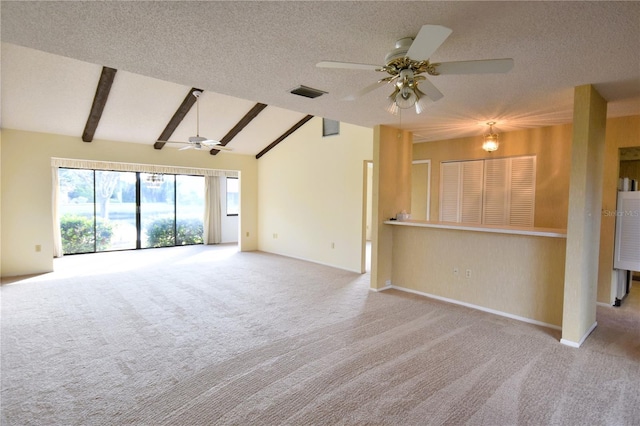 unfurnished living room featuring light carpet, a textured ceiling, and lofted ceiling with beams