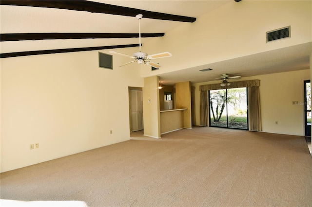 unfurnished living room with beamed ceiling, ceiling fan, light colored carpet, and high vaulted ceiling