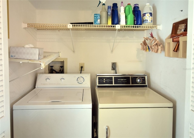 laundry area with washing machine and clothes dryer