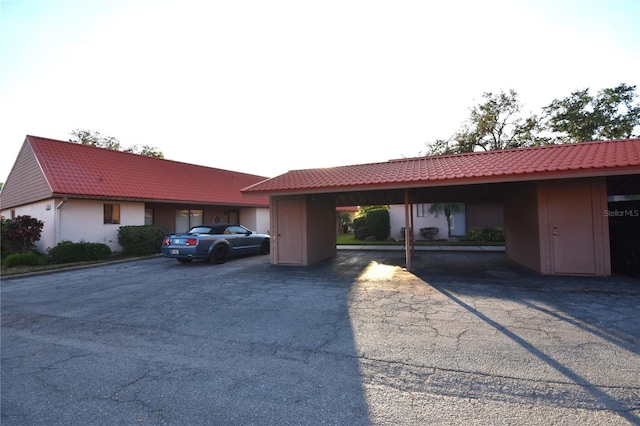 ranch-style home featuring a carport