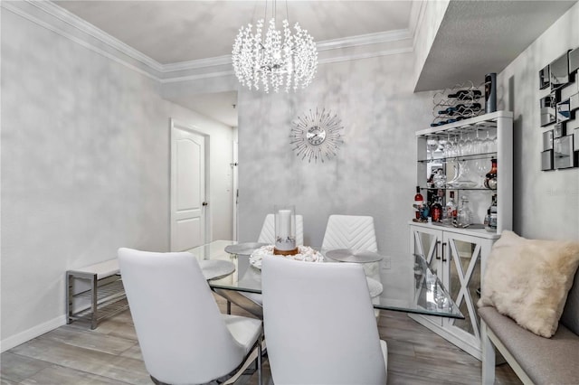 4106 Central Sarasota Pkwy Unit 1013, Sarasota, FL 34238 - dining area with wood finished floors, a chandelier, and crown molding
