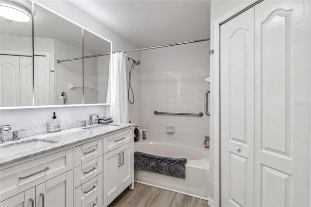 4106 Central Sarasota Pkwy Unit 1013, Sarasota, FL 34238 - full bath with shower / tub combo, double vanity, wood finished floors, and a closet