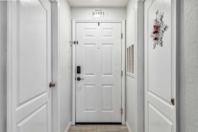 doorway to outside featuring light hardwood / wood-style flooring