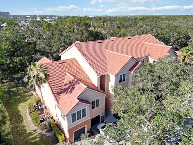 birds eye view of property with a wooded view