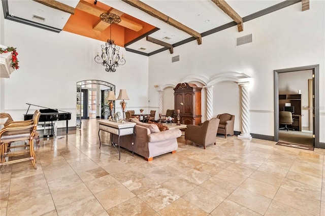 4106 Central Sarasota Pkwy Unit 1013, Sarasota, FL 34238 - living room with a high ceiling, beamed ceiling, decorative columns, a chandelier, and arched walkways