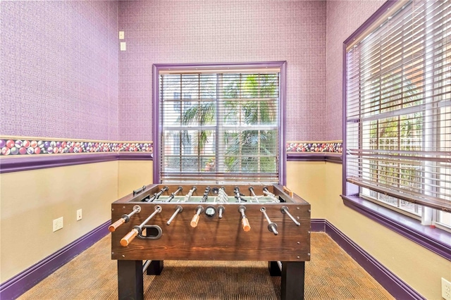 game room featuring wallpapered walls and baseboards