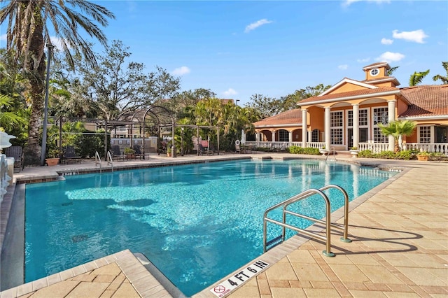 4106 Central Sarasota Pkwy Unit 1013, Sarasota, FL 34238 - community pool with a patio area