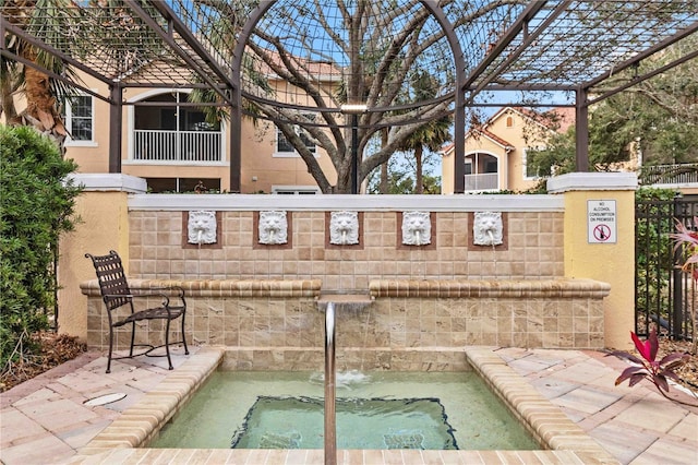 4106 Central Sarasota Pkwy Unit 1013, Sarasota, FL 34238 - view of patio / terrace with a hot tub