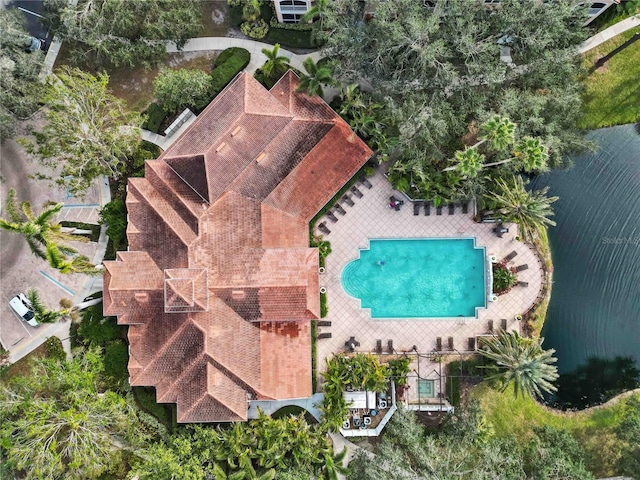 birds eye view of property with a water view