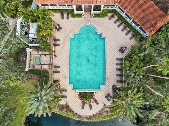 birds eye view of property with a water view